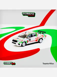 Tarmac Works Factory Sealed Hobby 64 Toyota Hilux Racing #18 White W/ Graphics