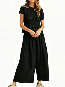 Women's Fashion Casual High-End Minimalist Textured Cotton Ruffled Short Sleeve Two-Piece Set, with waist-cinching ruffles and a flowing wide-leg pant design, perfect for summer, vacations, indoor, and outdoor wear