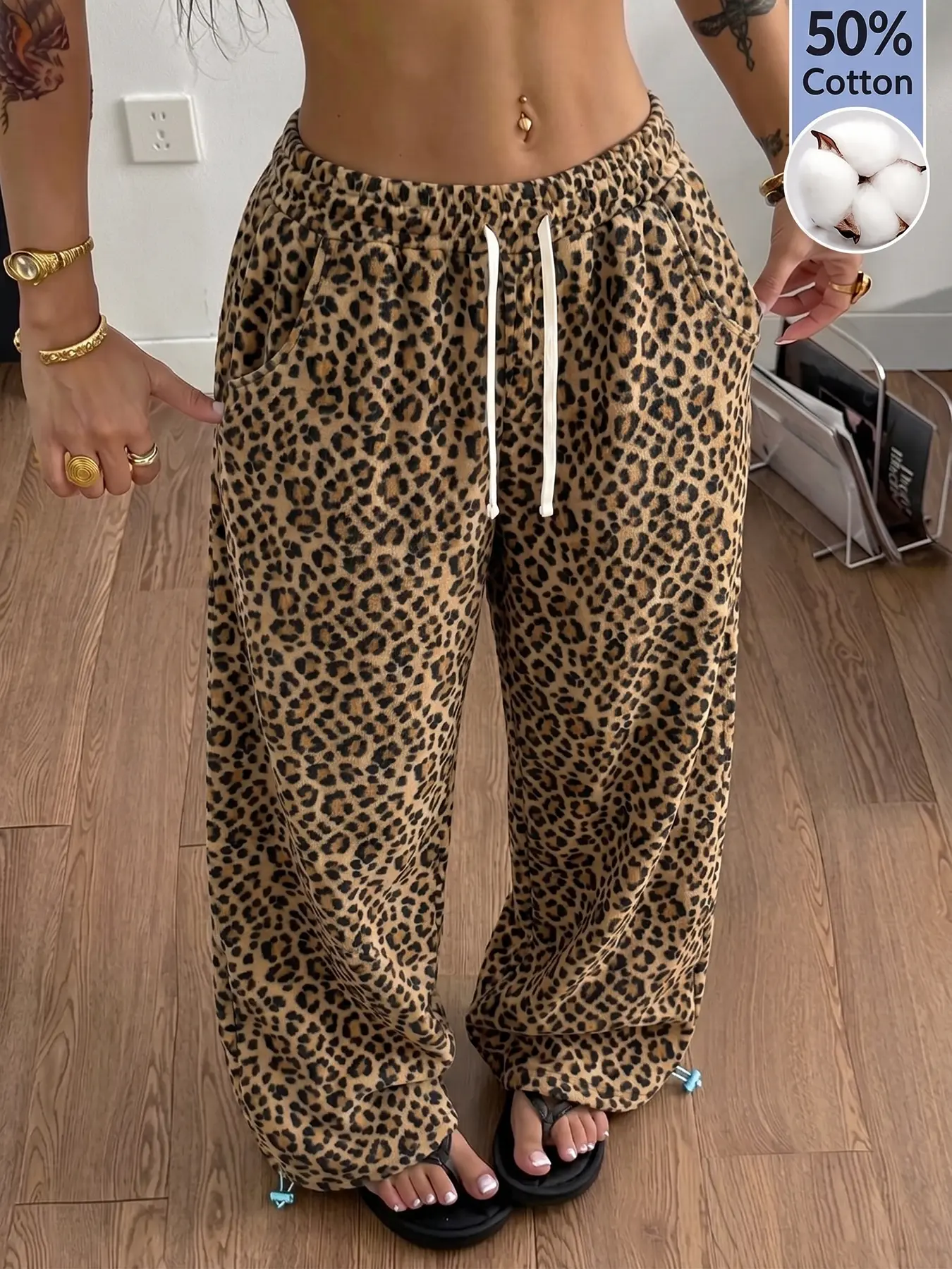 Women’s leopard-print loose sweatpants, 50% cotton comfortable wide-leg pants with drawstring, side pockets, Y2K retro loungewear, casual long pants suitable for everyday wear, the beach, travel, and streetwear looks.