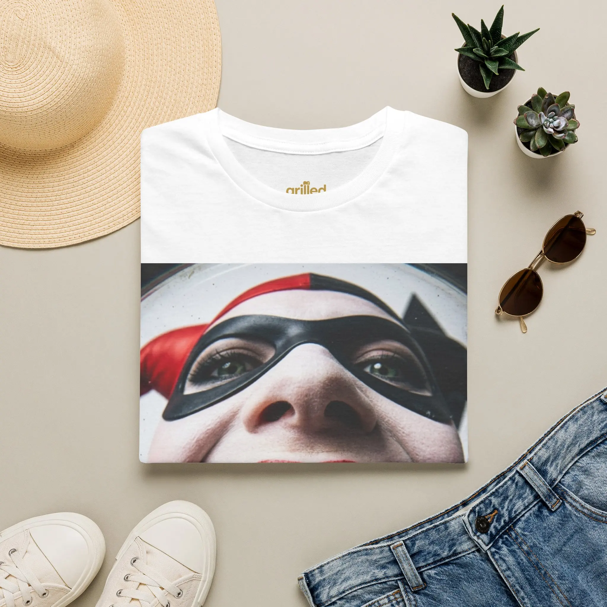 Crime Princess Graphic T-Shirt — Grinning Joker Face with 'WHO' Gold Grill Design
