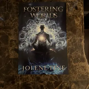 Fostering Worlds by Jolene Fine; A Sci-Fi Fantasy Book with Angels and Demons, Lovers to Enemies; A Ticking Prophecy, Warring Gods, Magical Battles, Female Villian , and Spirit Animals.