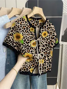 Women's khaki bohemian vacation short-sleeve knit top. Loose round neck, contrast patchwork leopard print, front tie and contrast piping. Perfect for spring & summer casual wear. Womenswear