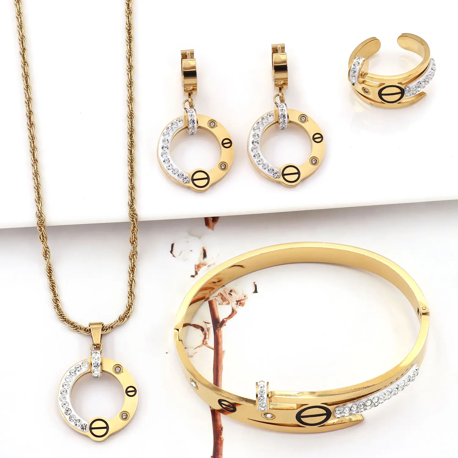 Resistant-to-fading bright gold tone screw rhinestone hoop twist chain four-piece set; waterproof stainless steel necklace, bracelet, stud earrings, and ring—versatile for everyday stacking.