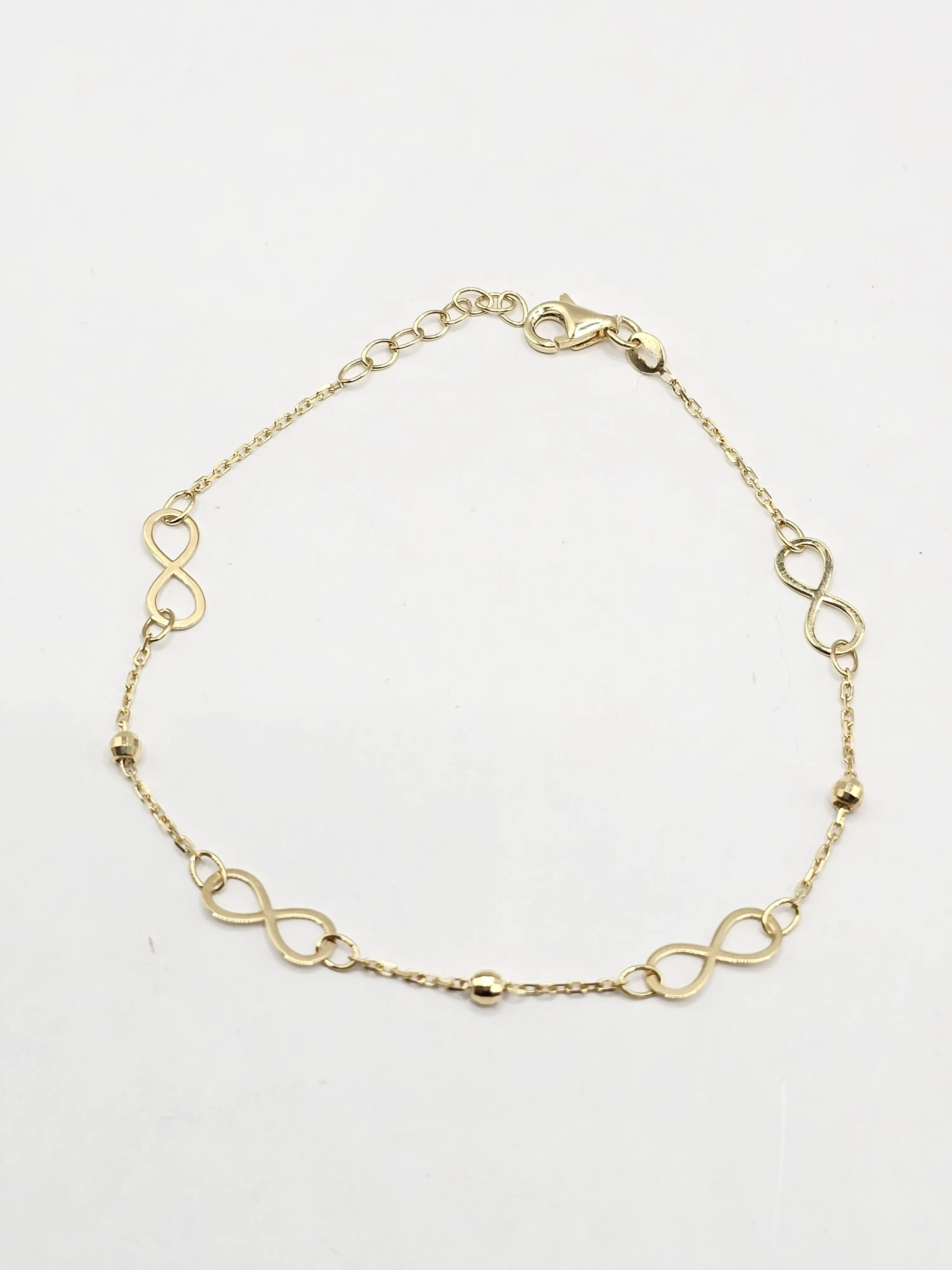 14K Gold Infinity Bracelet - Elegant Design with Continuous Loop Motif