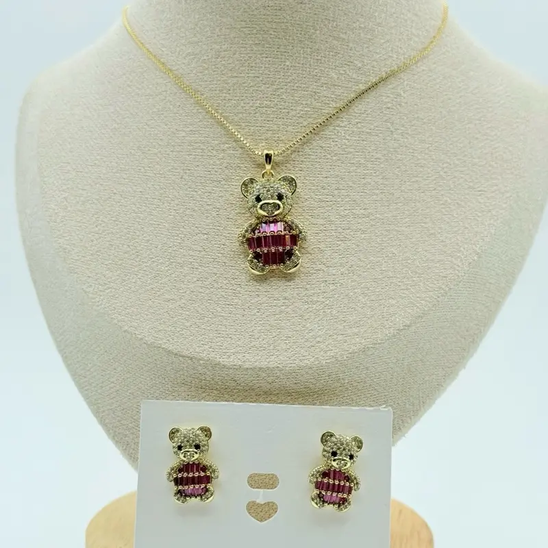 Cadena oro laminado oso 14k con diseño central y motivo circular para joyería decorativa