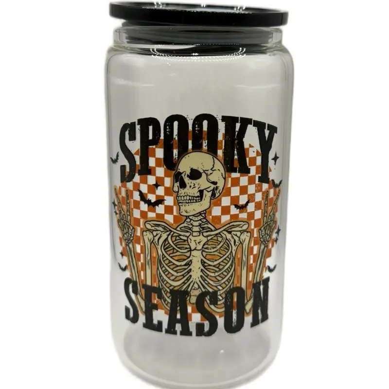 Spooky Season 16oz Glass Cup with Bold Skeleton Design Orange Checkerboard Accents Clear Can Style Reusable Eco Friendly Easy to Clean Perfect for Halloween Lovers