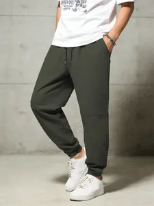Men's casual pants with elastic drawstring waist and elastic waistband design, simple solid color woven sports pants, leg tied pants, machine washable, suitable for casual sports daily wear (universal for all seasons) Casual Fit Bottoms Trouser