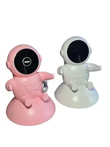 Astronaut Phone stand ，Phone stand with astronaut-shaped design that doubles as a charger