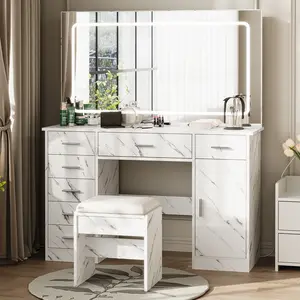 Brighten your morning routine with this white faux marble vanity desk. It features a large illuminated mirror with three light modes, seven drawers, built-in charging outlets, and a matching stool. Measures 47.2 inches wide.