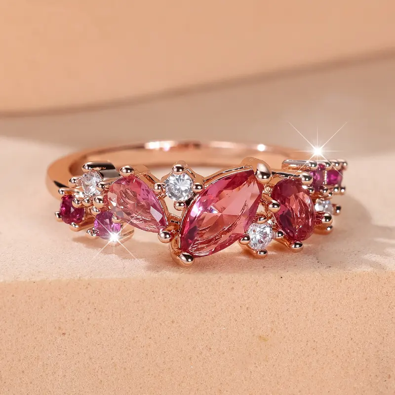 A rose gold round red corundum water drop ring made of synthetic red zirconia is suitable for women to wear daily at wedding parties