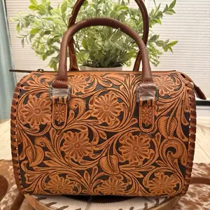 Handcrafted Floral Tooled Leather Speedy Bag with Adjustable Strap and Secure Zip Closure for Stylish Everyday Use