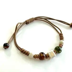 Ivory Bracelet Beaded Macrame Green Brown Bohemian Tan Cord Ceramic with Beads and Ceramic Elements