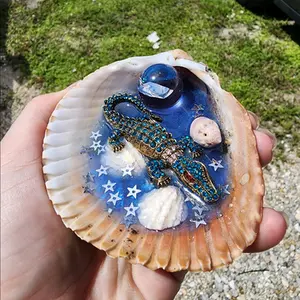 Gator in shell with clear quartz sphere