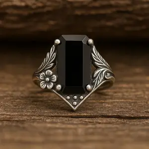 A vintage gothic-style imitation black onyx signet ring, incorporating naturalist patterns, crafted with classic hollow carving techniques, set with a rectangular emerald-cut black main stone. A bohemian-style ring, a gift for her.