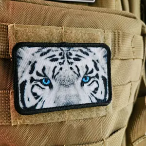 White tiger eyes 2"x3" morale patch with hook and loop backing