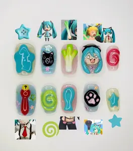 hatsune miku inspired press on nails with cute 3d designs featuring leek, cat, paw print, candy swirl, stars and anime face for a playful vocaloid nail art set