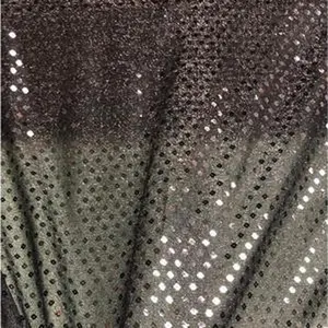 Soft sheer spandex Sequin Glitter fabric 45” wide.  Beautiful black on black sequin. Sold by the yard