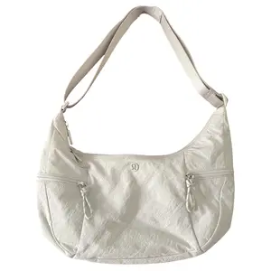 Lululemon Slouchy Sling 6L Crossbody Bag with Zipper Closure in Bone White for Women