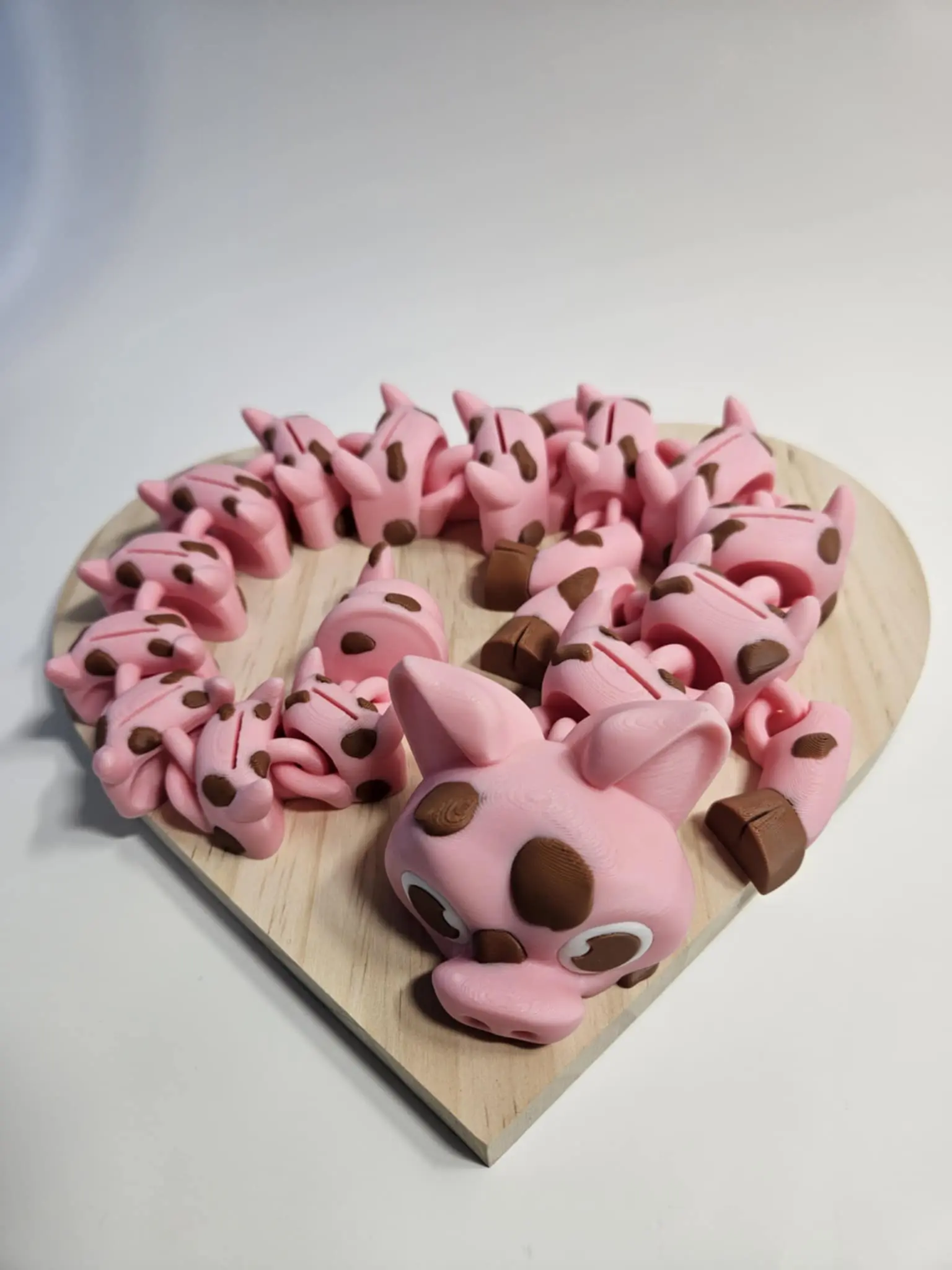 Pig in the mud 19in dragon designed by Studioambo. This unique piece combines playful pig imagery with a dragon motif.  Printed by Time2Dezign3d, ensuring a distinctive look. The 19-inch size makes it a statement piece for any space.
