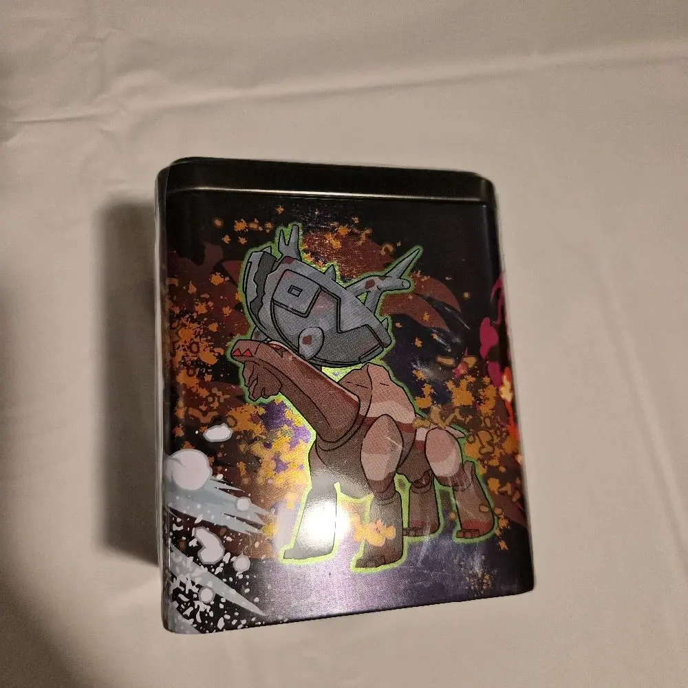 pokmon trading card game: stacking tin- ogerpon 2025 Tin (Treasures of Ruin-Paradox Pokmon-Ogerpon) Sammy's Shop or feisty Ogerpon and its masks 2025 Pokemon Stacking Tin Factory