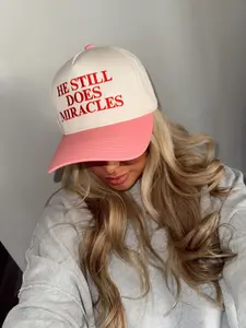 He Still Does Miracles Trucker Hat