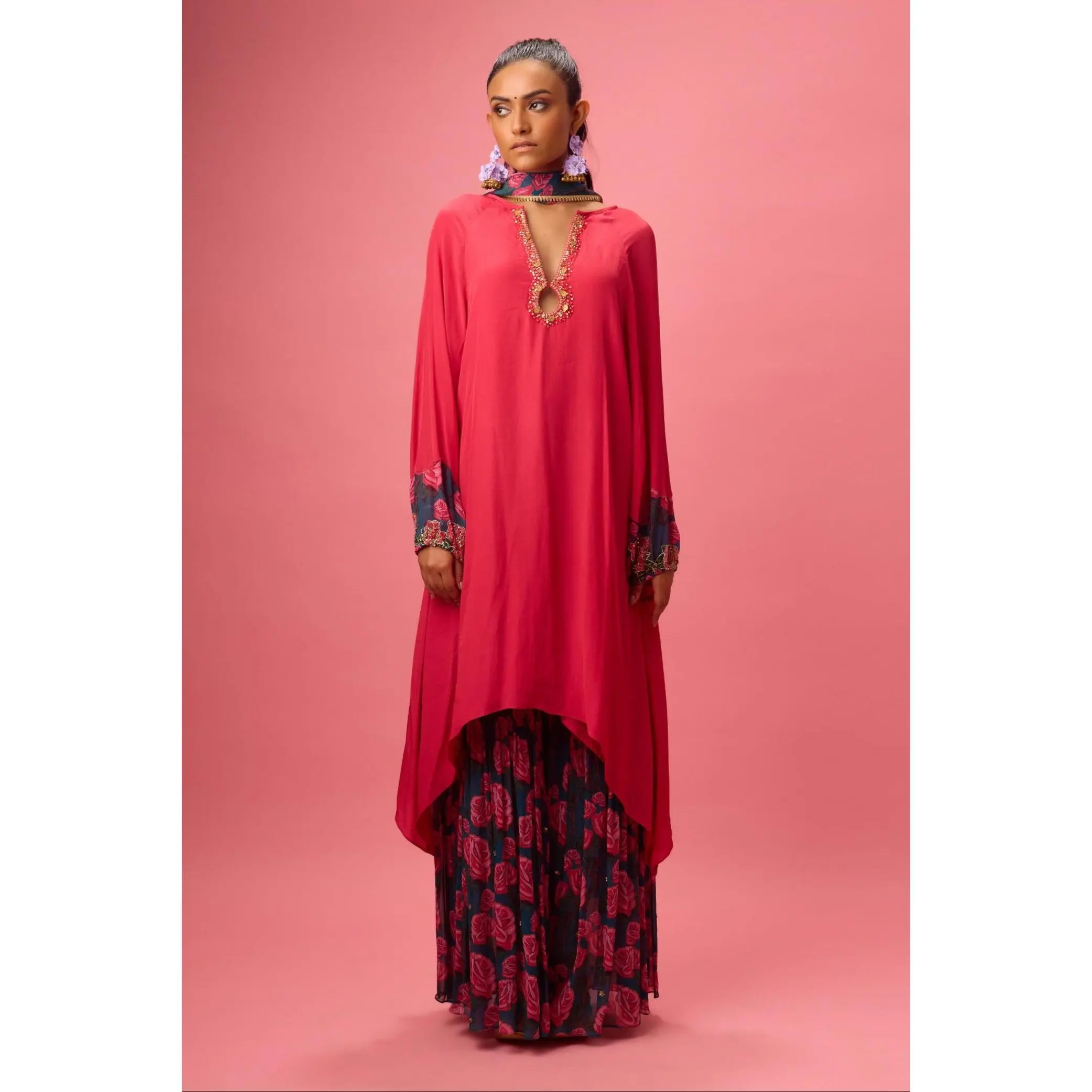 Red watermelon solid crepe asymmetrical handwork kurta paired with printed sharara and dupatta