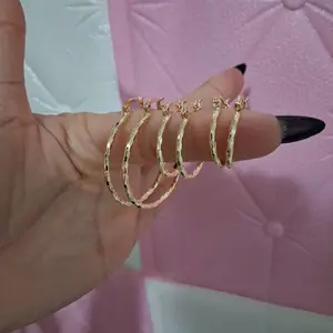 Set  of 3 pairs of 14 k gold laminated Hoop Earrings.