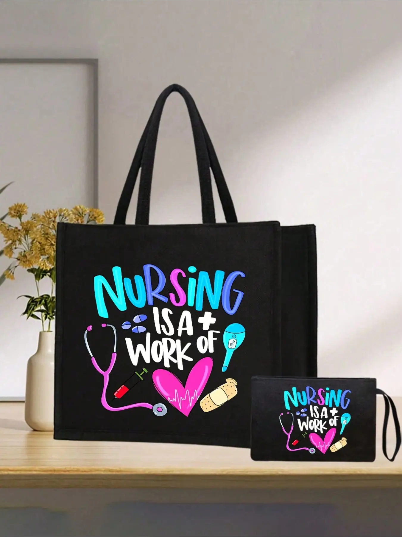 The Nursing is a Loving Profession tote bag and pouch set, a canvas tote bag with a stethoscope and medical elements, is a perfect gift for nurses, nursing students, doctors, and medical staff. The large-capacity black tote bag comes with sturdy handles