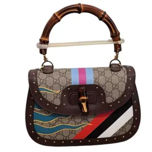 Pre-owned GUCCI canvas Crossbody Bags Bamboo 1947 Top Handle Bag, specifically part of the brand's "Centum" Centennial Collection