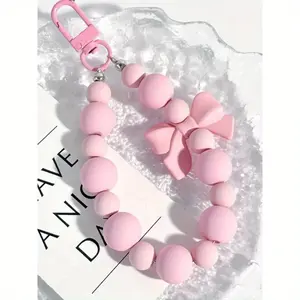 Pink pearl bow keychain, phone lanyard, headphone storage bag, anti lost rope, car keychain, bead pendant, backpack accessories
