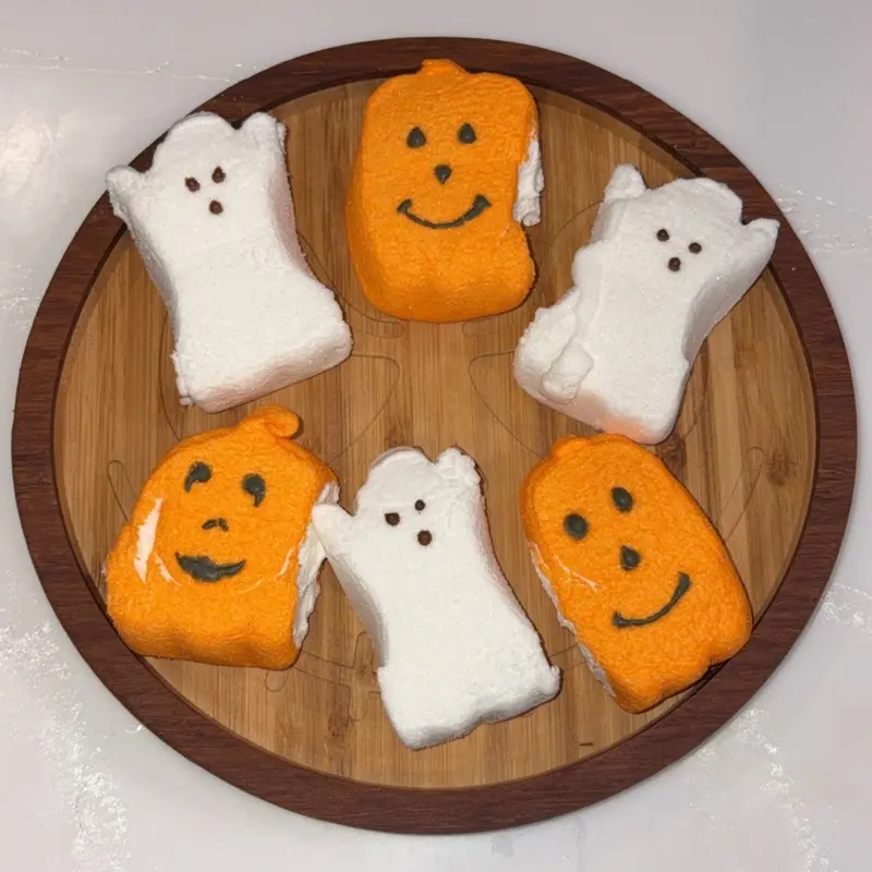 Halloween Decor Snack Trays with Ghost and Pumpkin Shapes on Wooden Plate for Festive Treats