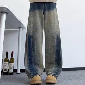 Versatile men’s denim jeans for commuting and campus wear—gradient distressed long pants with a distinctive split design, loose straight cut, vintage look.