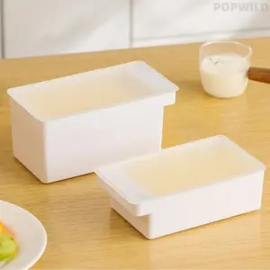 Multifunctional butter storage box with slicer, great for fridge storage. It cuts and preserves butter, cheese slices conveniently. Food-safe design keeps ingredients fresh, practical kitchen helper for daily refrigeration and portioning food.