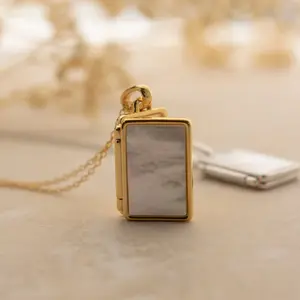 Pearl Locket Necklace by Caitlyn Minimalist.