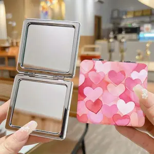 1 Adorable Heart-Shaped Mini Mirror - Double-Sided Portable Makeup Mirror with 1x and 2x Magnification, Perfect for Travel. An Ideal Valentine's Day Gift for Her and a Surprising Birthday Surprise for Girls and Women.