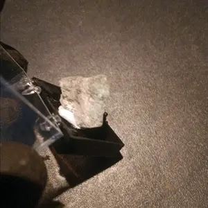 1 Emerald stone in its own display case.