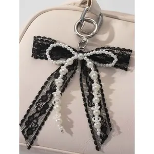 Simple pearl lace bow keychain, black and white contrast beaded pendant, niche design bag pendant, keychain small shoulder crossbody bag small object pendant keychain, Keychain For Bags