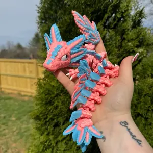 Glow in the dark pink and blue winged dragon fidget Colorful