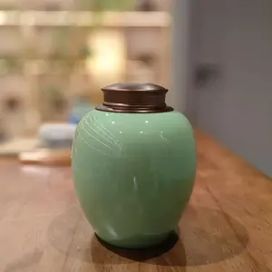 Handmade Yixing celadon tea jar