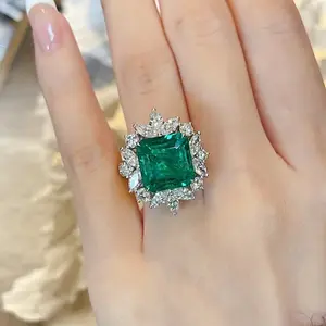 emerald A luxurious hand polished Moissanite ring paired with emerald zircon. Exquisite craftsmanship. Sparkling Moissanite and emerald zircon. Master level aesthetic design. Excellent quality. Brilliant and radiant. High quality hand polished.