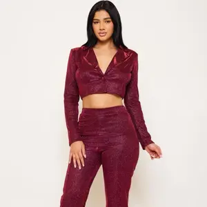 GLITTERED FABRIC SUIT TOP AND BOTTOM SET CROP TOP-COLLARED V-NECK ONE BUTTON CENTERED LONG SLEEVE WIDE NECK LONG PANTS - ELASTIC WAIST WIDE LEG SLIP ON MODERATE STRETCH MODEL: 5'8" AND IS WEARING A SMALL SELF:95%POLYESTER 5%SPANDEX, LINING: 100%POLYESTER