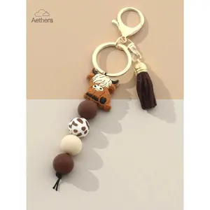 Aethera Highland Cow Silicone Beaded Keychain with Tassel Cute Cartoon Punk Style Animal Theme Lobster Clasp Ideal Gift for Friends Keychain for Bags Anti-Lost Feature