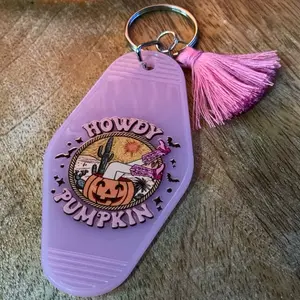 Howdy Pumpkin Keychain - Pink Tassel Decor with "Howdy Pumpkin" Text and Pumpkin Graphic Design