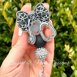 Bushel & Peck Designs Cow Print Coquette Bow Badge Reel Medical Retractable with Clip Hand Glittered Acrylic Blank 2.0"