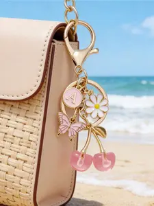 Pink cherry blossom & butterfly A-Z letter Floral Pattern keychain. Cute durable pendant for car keys, bags, backpacks and daily decor. Perfect gift for birthdays, graduation, anniversaries and festivals for ladies and friends.