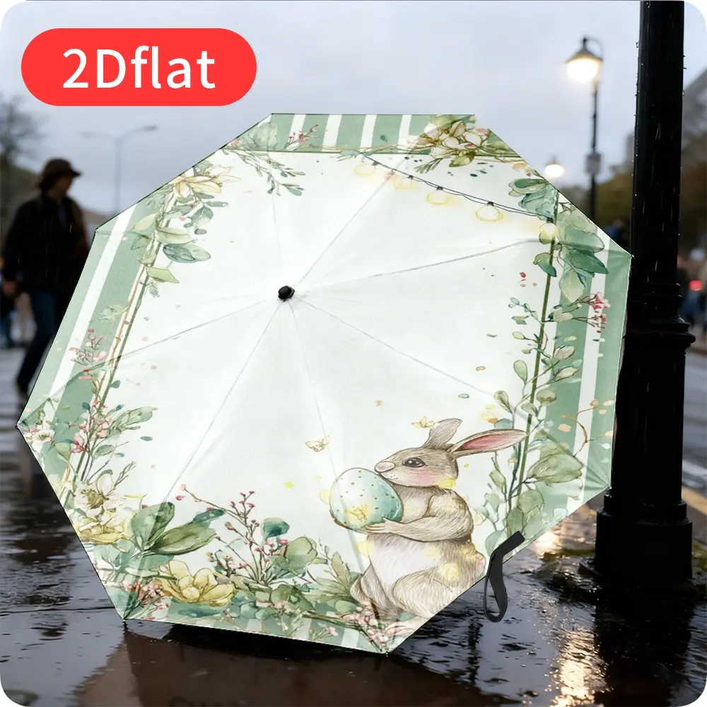 An Easter Bunny Folding Umbrella – Featuring an adorable cartoon bunny holding colorful eggs, adorned with floral and plant motifs. Lightweight and portable, with a durable canopy made of sturdy plastic and metal