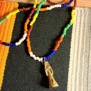 Santamuerte Beaded Necklace with Colorful Beads and Unique Gold Charm Pendant 36 Inches Length for Casual or Formal Outfits