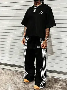 This men's two-piece Matching set includes a star-patterned T-shirt and trousers adorned with letters and stars. Made from a knit fabric, it's suitable for Casual everyday wear and can be worn year-round.