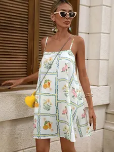 A women's floral and fruit-printed halter-neck off-the-shoulder sleeveless dress, loose-fitting and versatile, with a beachy vibe.