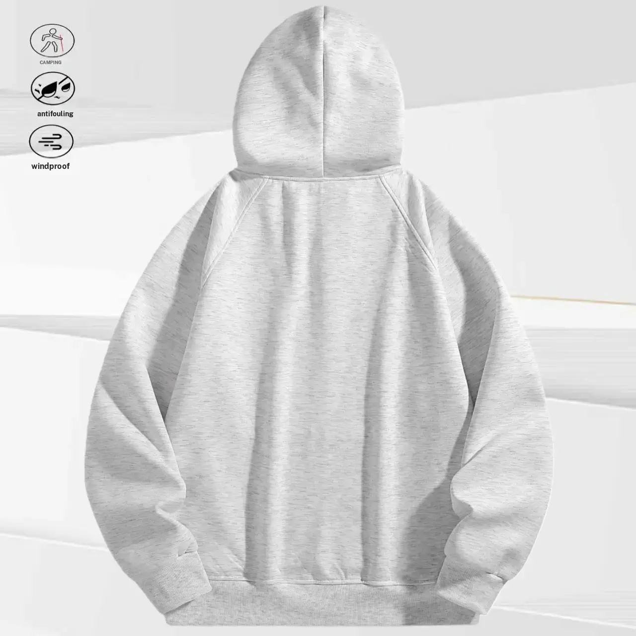 A men's zip up hoodie with a unique eye hole cutout design